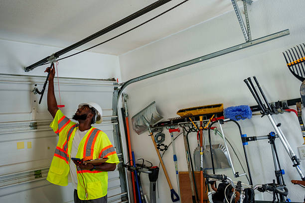 Professional Garage Door Panel Replacement technician working in East Peoria, IL